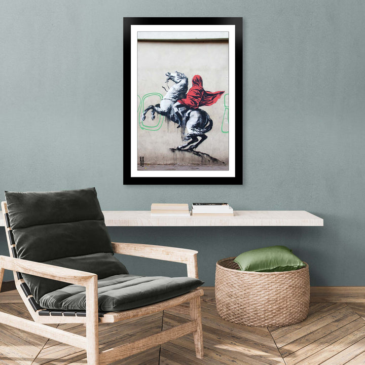 Blind Bonapart, a framed print of Banksy's Graffiti-Homekor, Mounted in a cozy room