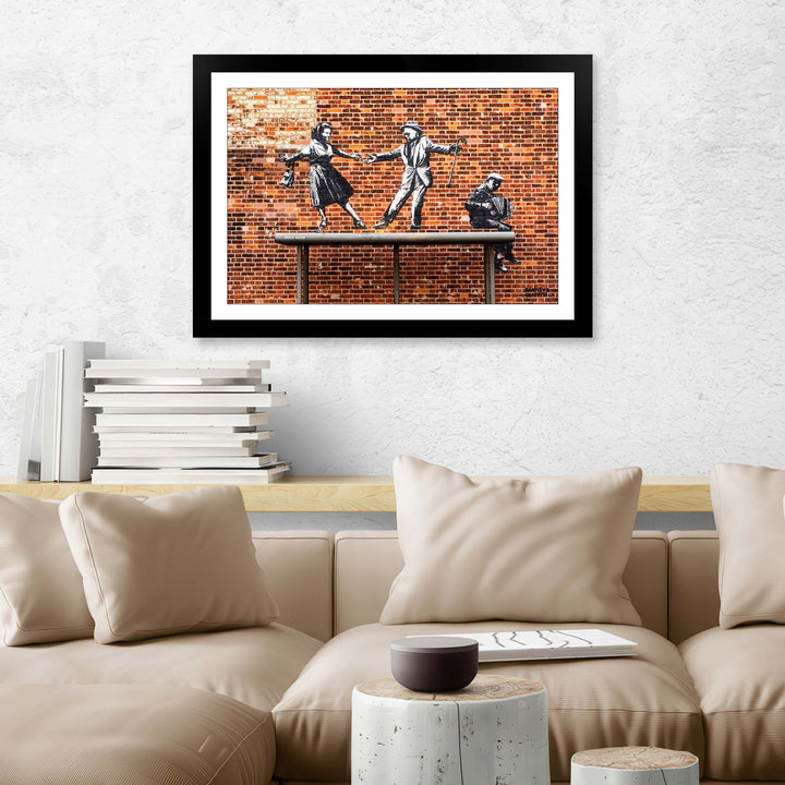 Bus Stop Dancers, a framed print of Banksy's Graffiti-Homekor Mounted in a cozy room