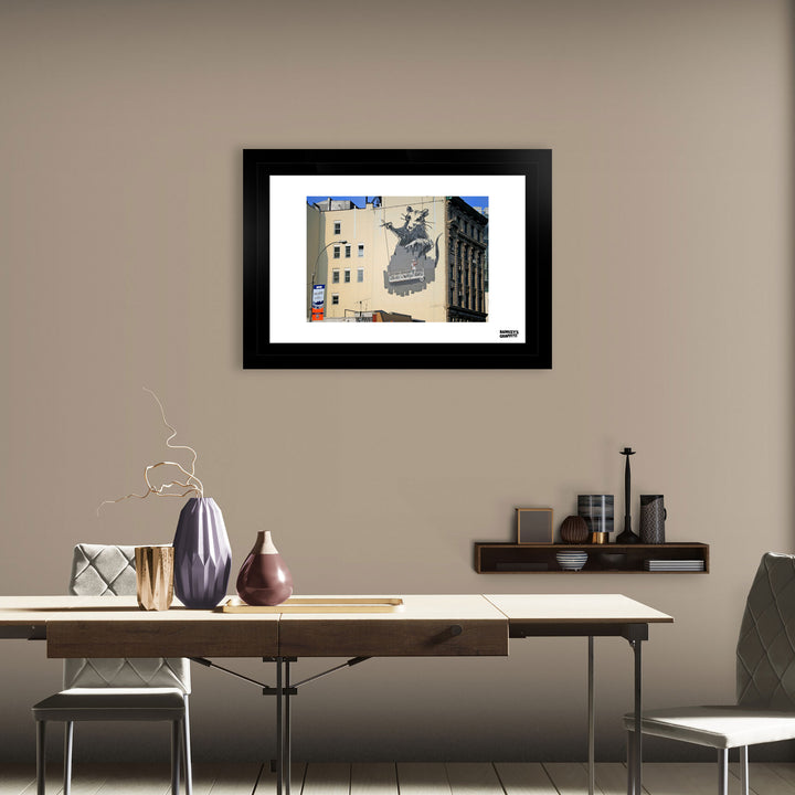 Gantry Rat, a framed print of Banksy's Graffiti-Homekor Mounted in a cozy room
