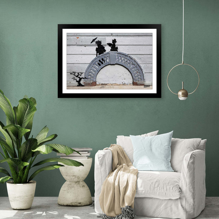 Japanese Ladies, a framed print of Banksy's Graffiti-Homekor Mounted in a cozy room