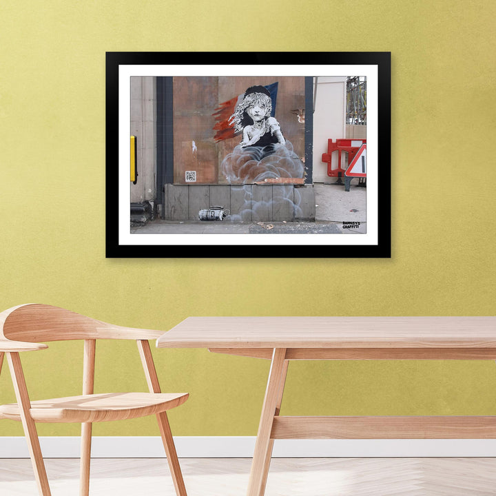Les Miz, a framed print of Banksy's Graffiti-Homekor Mounted in a minimalistic room