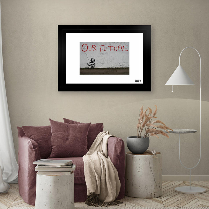 Our Future, a framed print of Banksy's Graffiti-Homekor Mounted in a cozy room