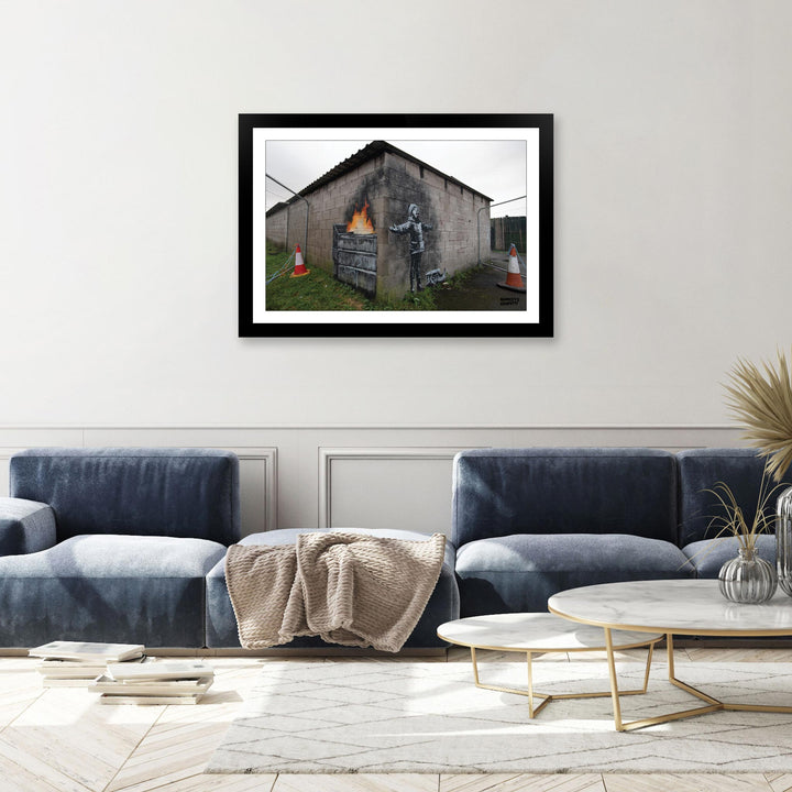 Snowflake Boy, a framed print of Banksy's Graffiti-Homekor Mounted in a cozy room