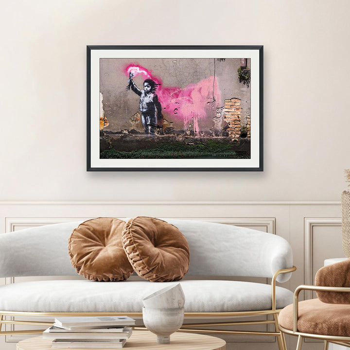 The Migrant Child, a framed print of Banksy's Graffiti-Homekor Mounted in a cozy room