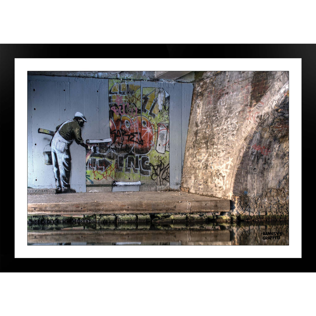 WallPaper man, a framed print of Banksy's Graffiti-Homekor