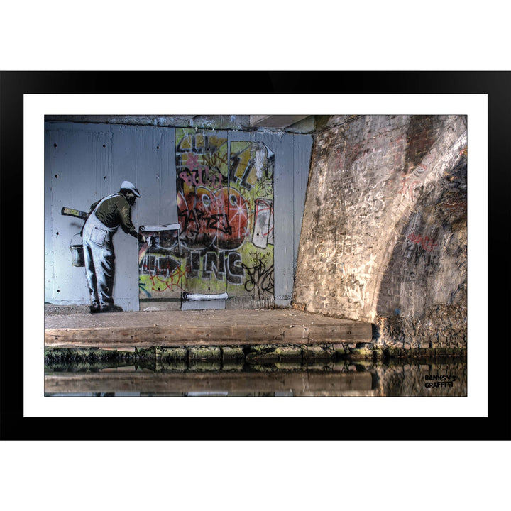 WallPaper man, a framed print of Banksy's Graffiti-Homekor